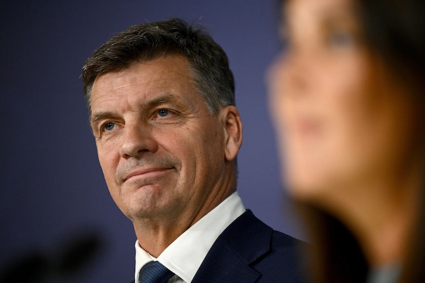 Angus Taylor in sharp focus as he stands beside deputy Jane Hume.