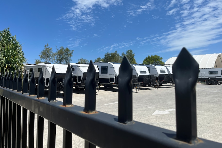 caravans behind fence