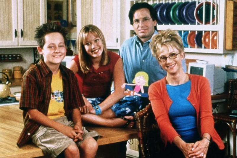 A family picture of four people on the set of Lizzie McGuire.