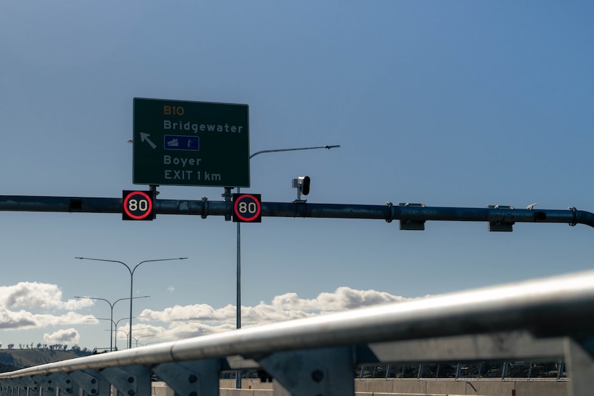 Speed signs and a street sign that says Bridgewater exit.
