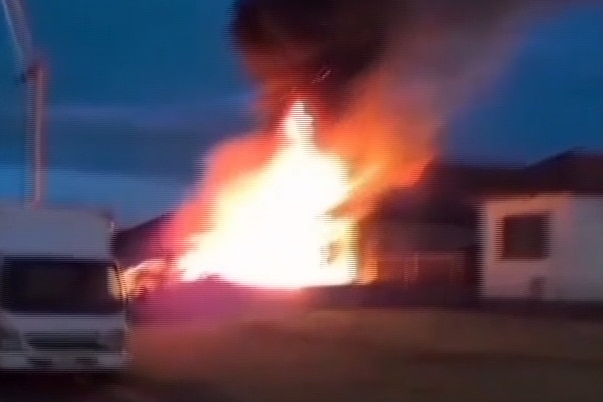 Mobile phone vision appearing to show an arson attack carried out on a house