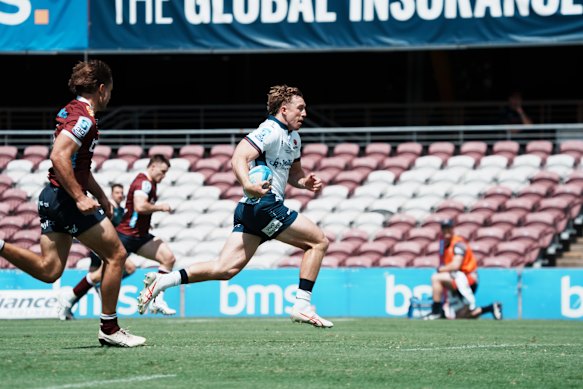 Wallabies winger Harry Potter races over to score the Waratahs’ first try in a pre-season game against the Reds at Brisbane