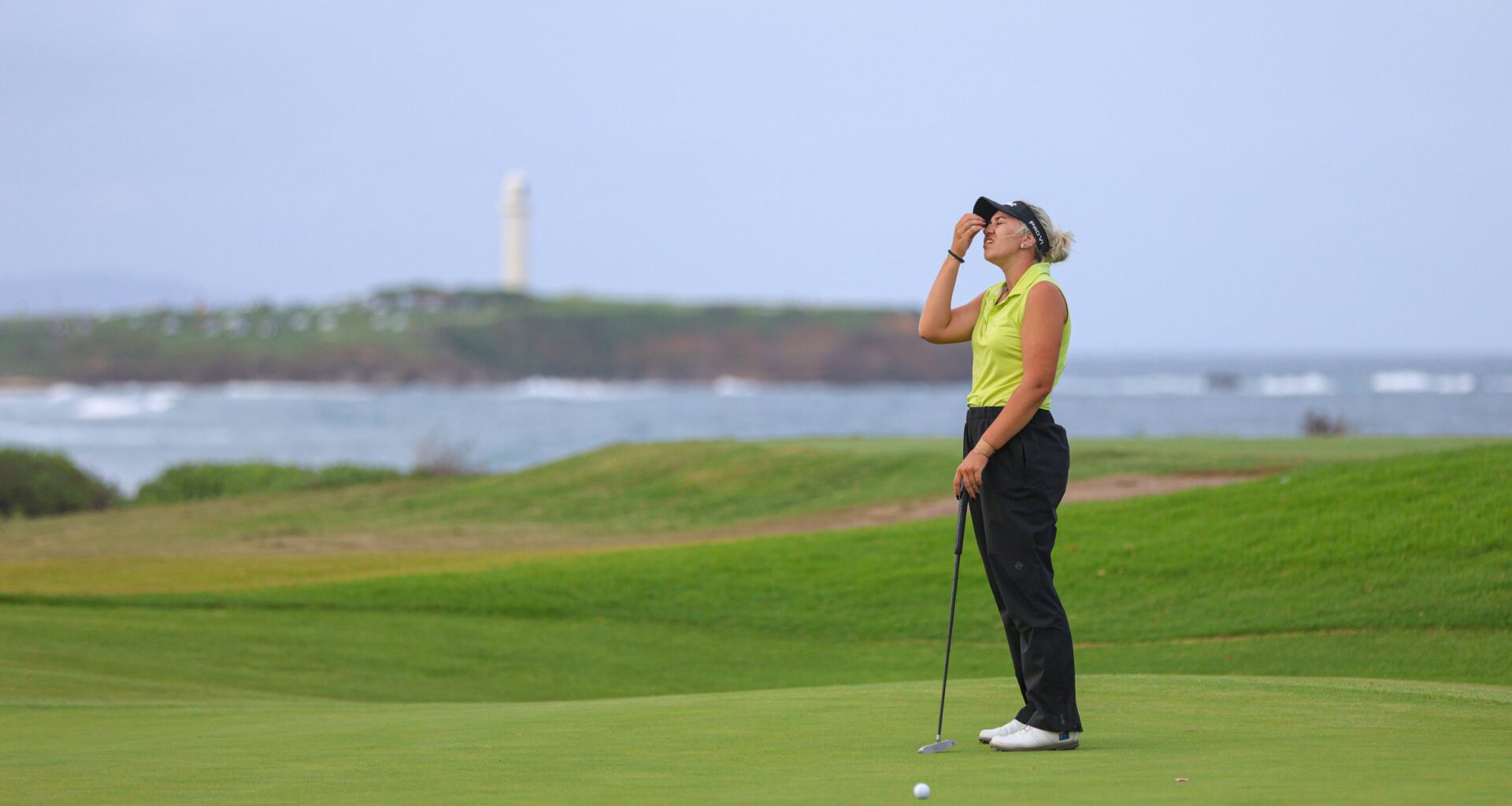 A golfer looking unhappy with a shot