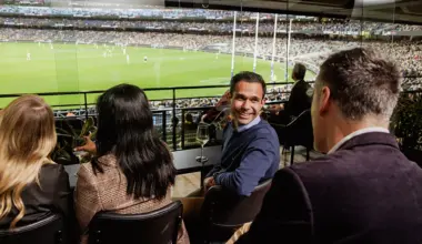 Patrons on private viewing deck at an AFL match