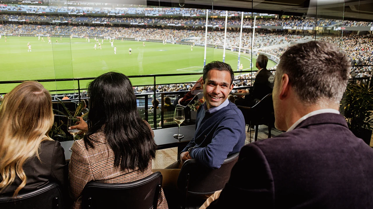 Patrons on private viewing deck at an AFL match