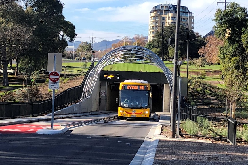 A bus leaving a tunnel