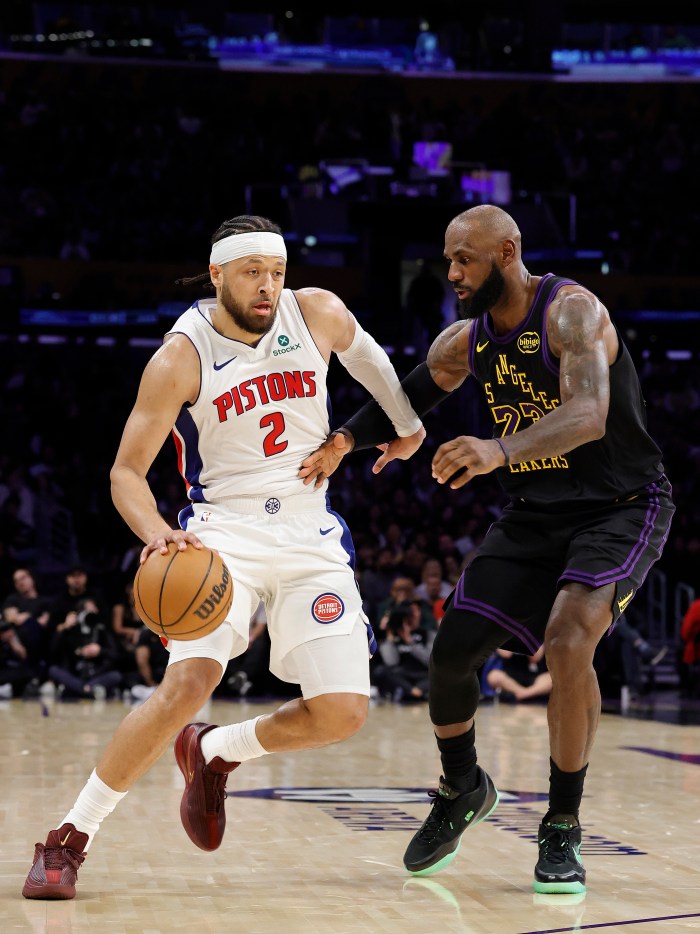 Cade Cunningham drives to the basket against LeBron James.