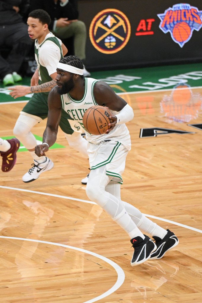 Neemias Queta dribbles the ball