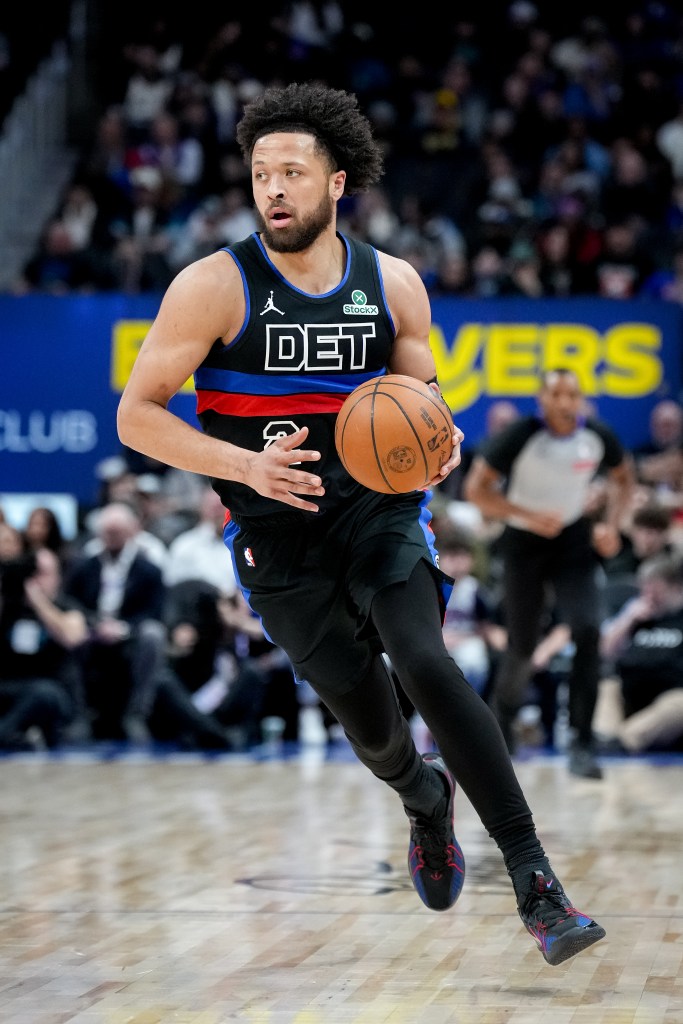 Cade Cunningham dribbles the ball.