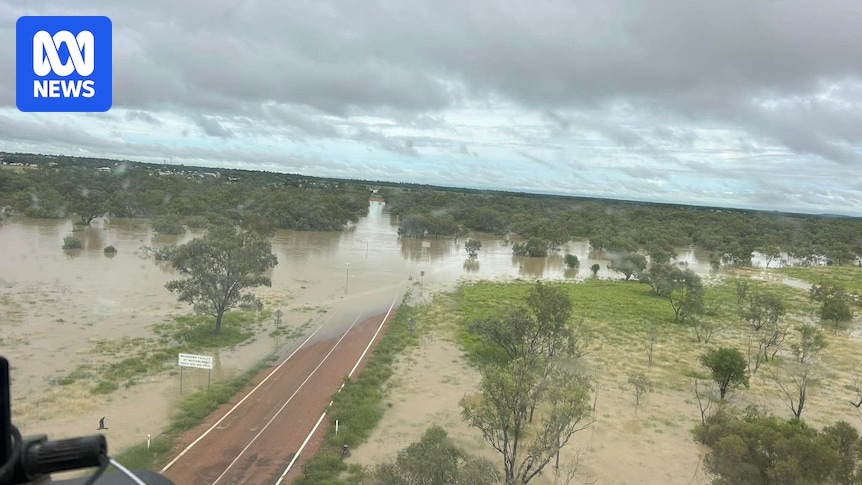 Central Australia tropical low expected to linger for days as flooding cuts off towns