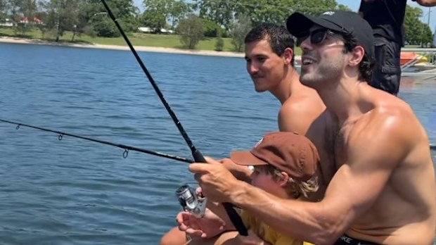 Christian Petracca fishing with teammate Wil Powell.