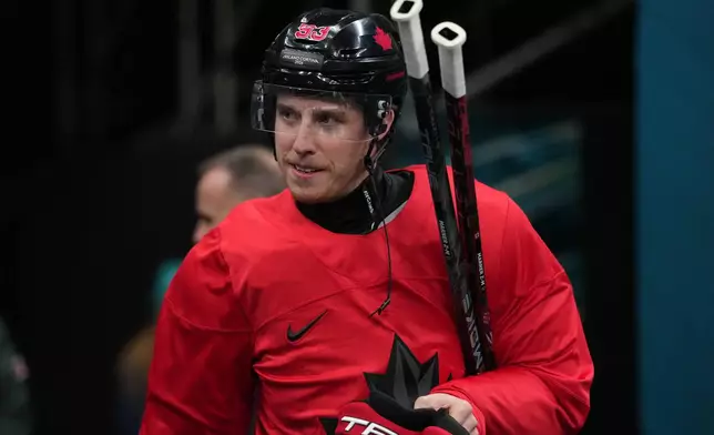 Canada's Mitch Marner arrives for men's ice hockey practice at the 2026 Winter Olympics, in Milan, Italy, Sunday, Feb. 8, 2026. (AP Photo/Carolyn Kaster)