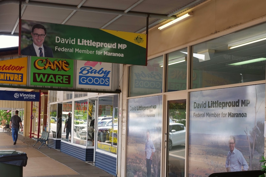 A glass shopfront with a sign hanging in front of it that says "David Littleproud MP".