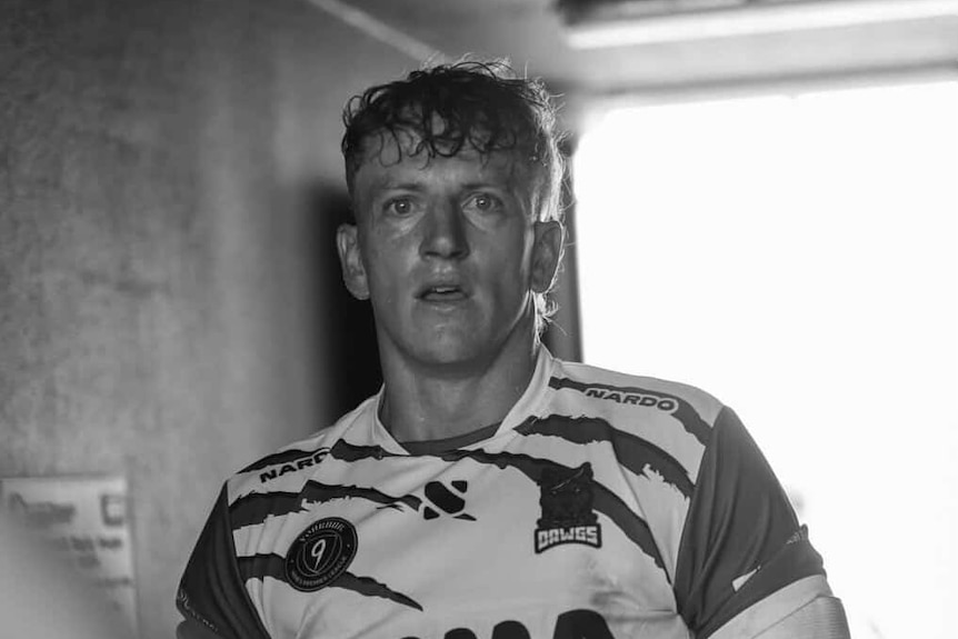 Jacek McLaurin, pictured in a black and white photo, wears a rugby league jersey.