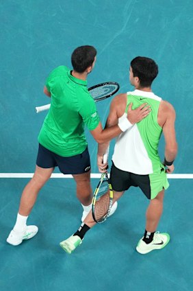 The friendly rivals show their respect for each other post match.