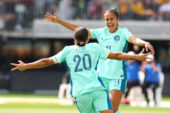 Sam Kerr and Mary Fowler celebrate a goal against the Philippines in Perth in late 2023.