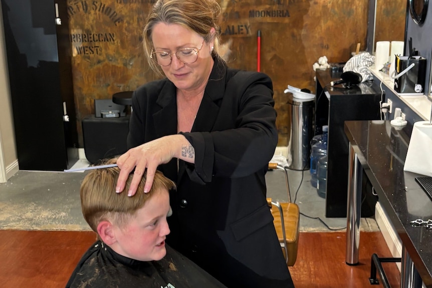 A boy getting a haircut.