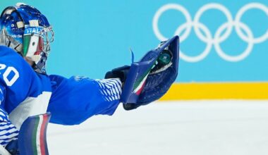 Lighter-colored boards replace dark ones in the hockey arenas at the Olympics