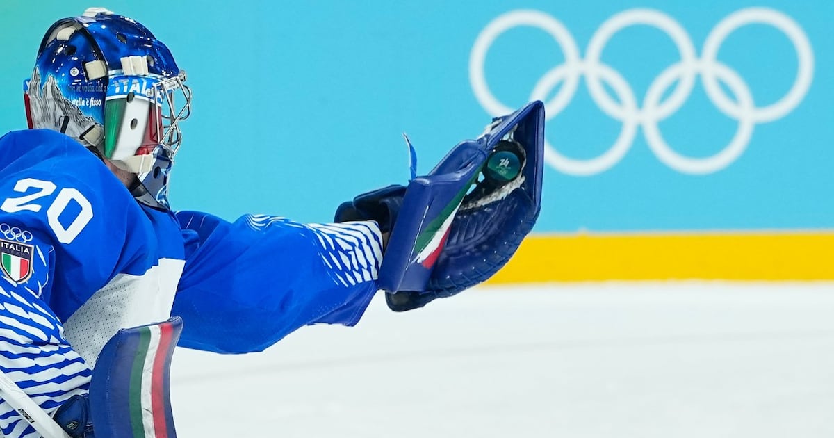 Lighter-colored boards replace dark ones in the hockey arenas at the Olympics