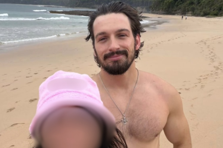 A selfie of Brandan Koschel to the right, in a black shirt and smiling, next to an unidentifiable woman.