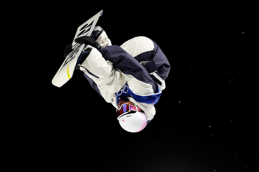Ruka Hirano upside down on his snowboard