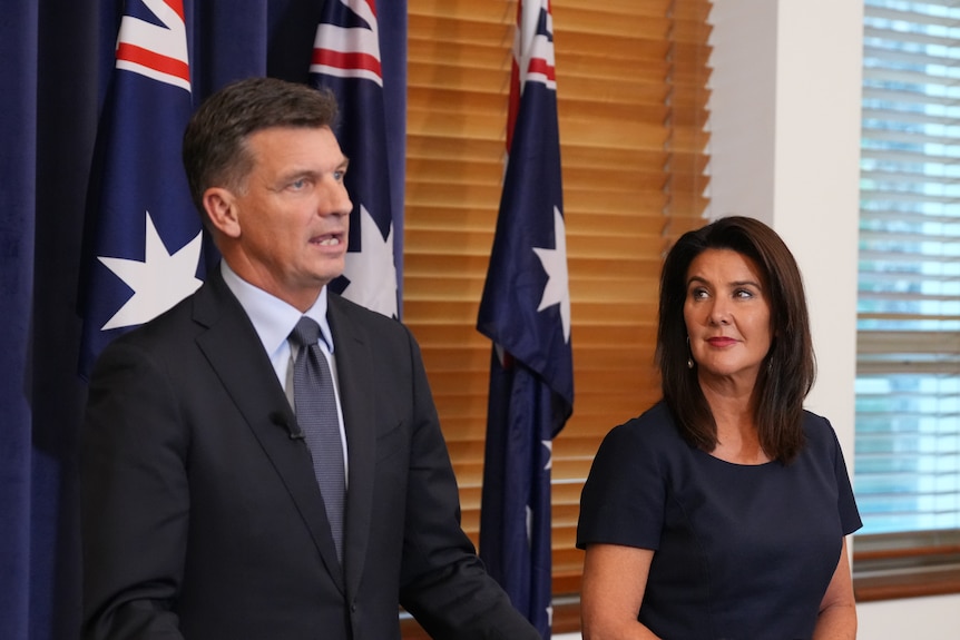Angus Taylor and Jane Hume stand next to each other