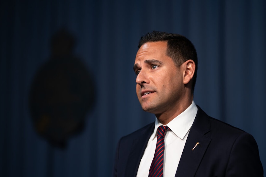 A man wearing a suit and tie