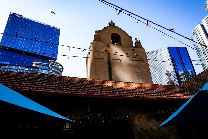 The exterior of the Mission to Seafarers Building, showing blue sky and surrounding buildings