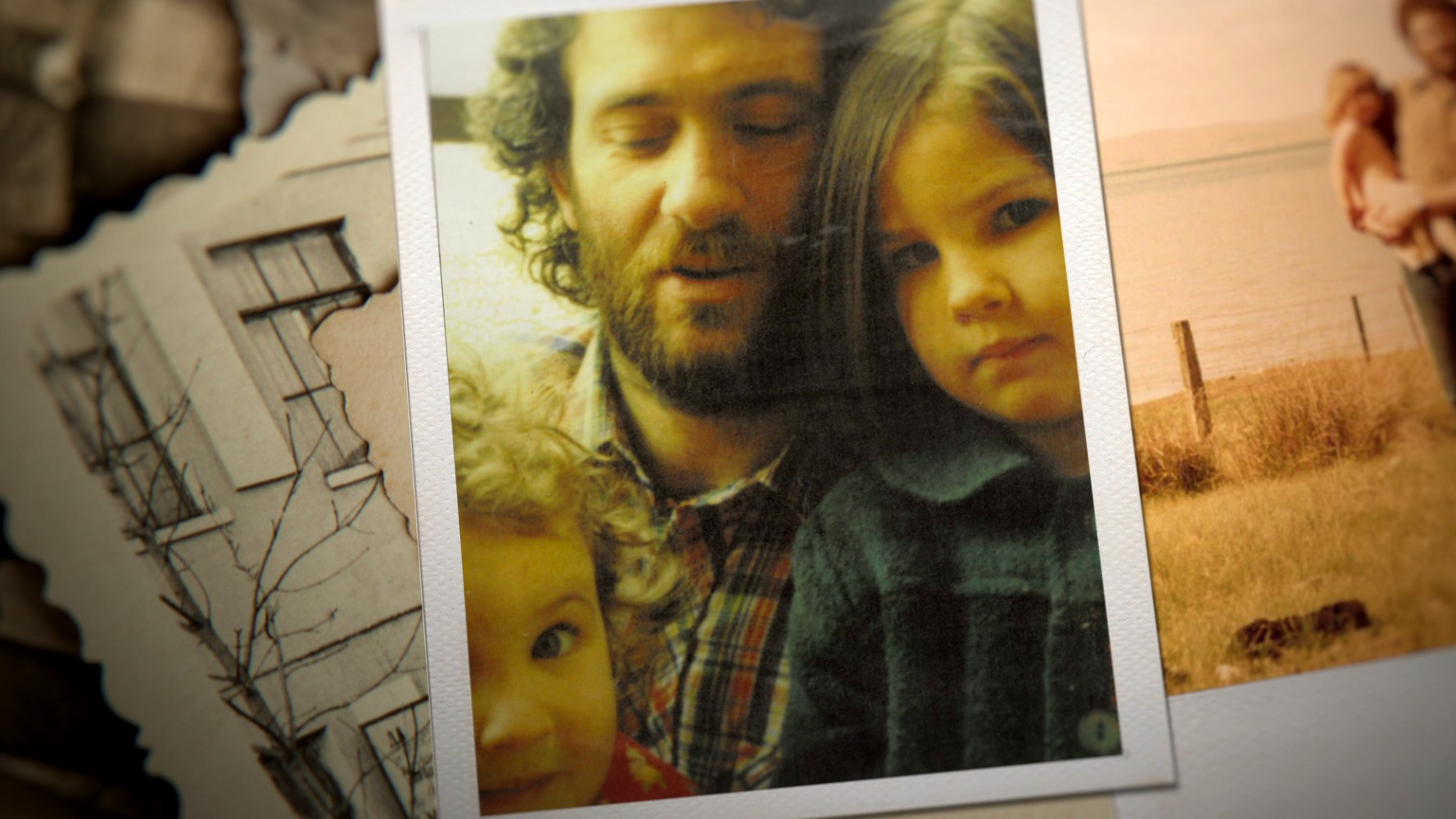 A man with a beard and shaggy hair with his two young daughters