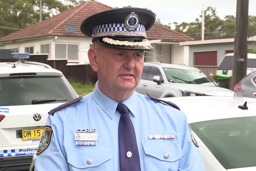 Assistant Commissioner Brett McFadden talks to the media