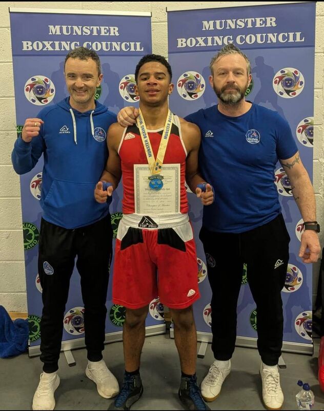 Cork Boxing: Togher coaches Philip Dwyer and Ian Power with Munster champion Peter Camara.