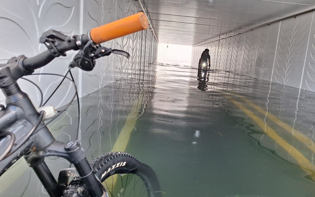 The flooded Petone railway underpass on the nearly-new $70 million cycleway.