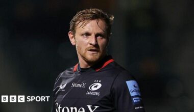 Callum Braley looking to his left while standing on the pitch during a game for Saracens