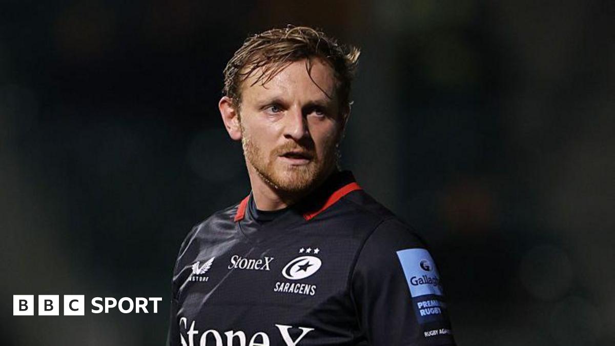 Callum Braley looking to his left while standing on the pitch during a game for Saracens