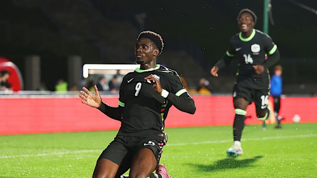 Mohamed Toure of Australia celebrates after scoring.