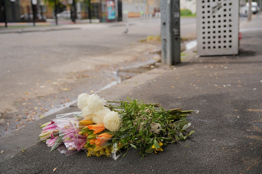 Flowers left near the crime scene in Fitzroy.