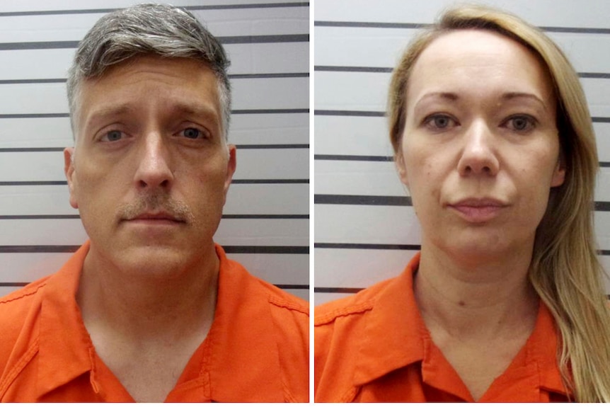 A greying man and blonde woman seen standing in mugshots on a striped wall while wearing orange prison jumpsuits.