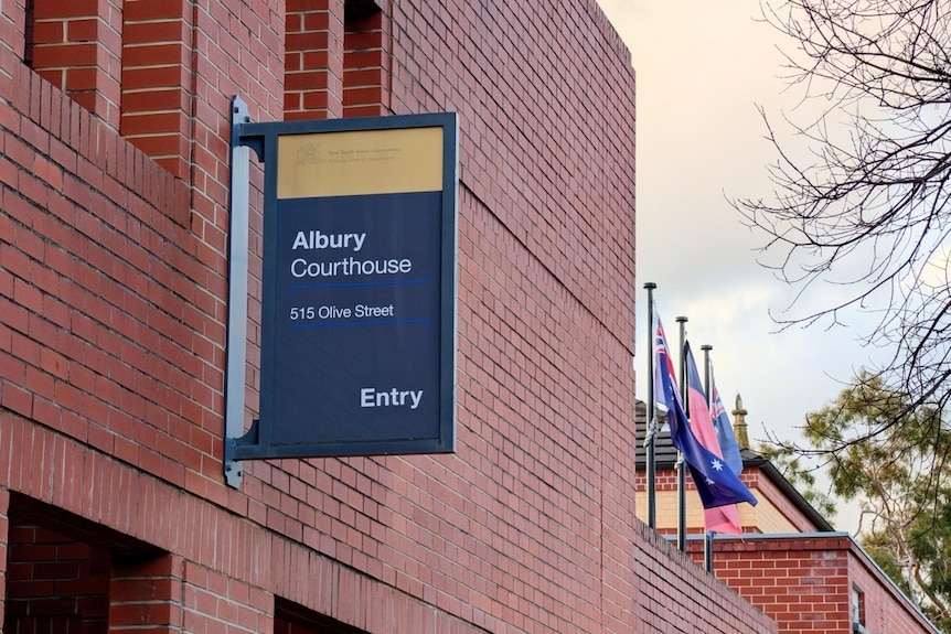 A picture of a sign detailing the front signage of the Albury court house.