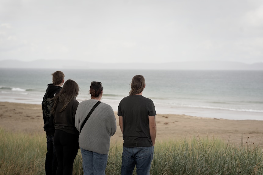 A family look out over the beach