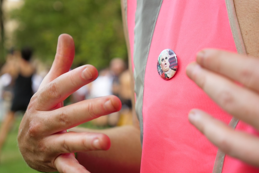 A pin with the face of Maxi Shield