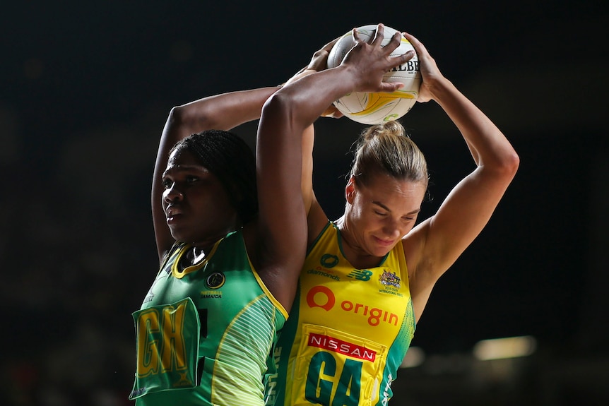 Roxanna McLean of Jamaica and Kiera Austin of the Diamonds tussle for the ball