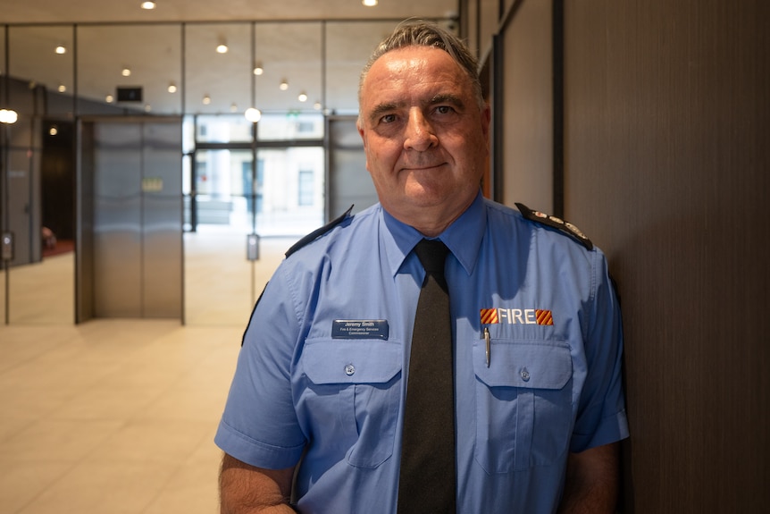 A fire fighter in uniform.