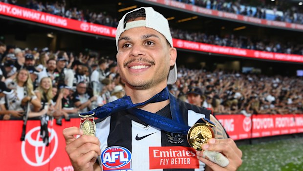 Bobby Hill of the Magpies celebrates winning the Norm Smith Medal in 2023.
