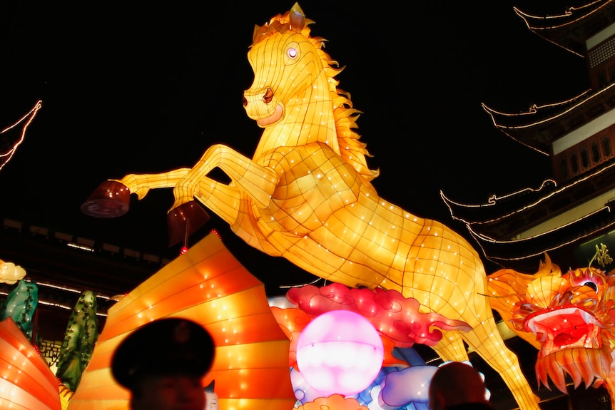 A lantern of a rearing horse on a parade float