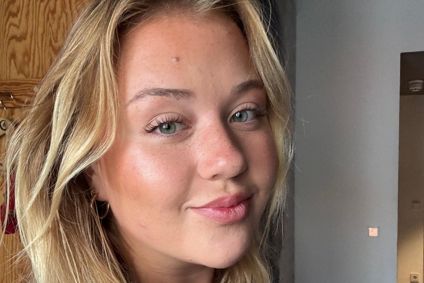 A close up selfie of a young woman.