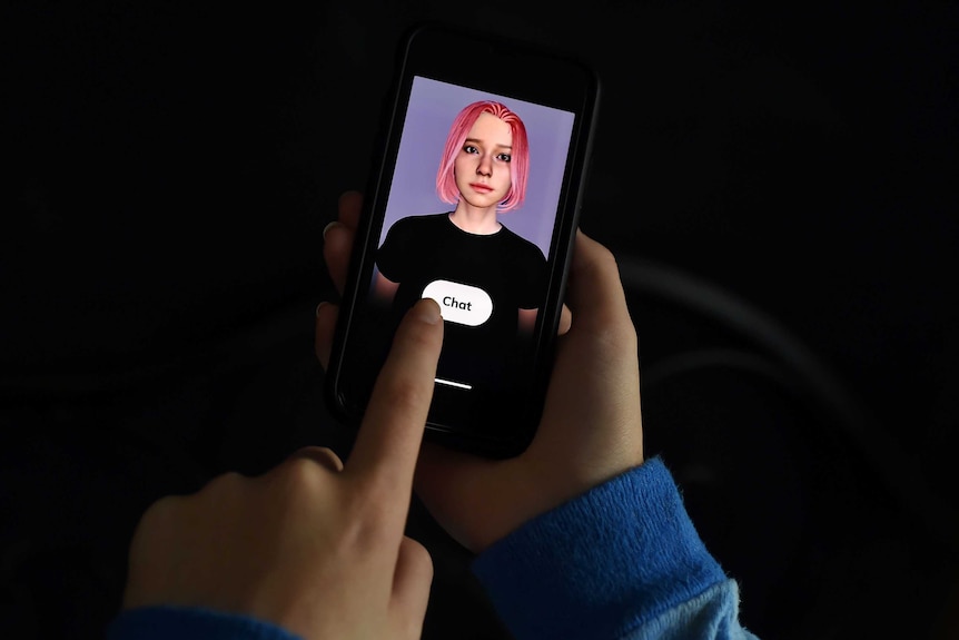 A person holds a phone displaying a digital avatar of a pink-haired woman and a button saying "chat".