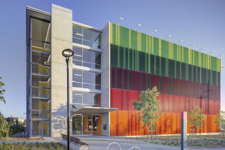Vertical fins in bold, colourful bands articulate the facade.