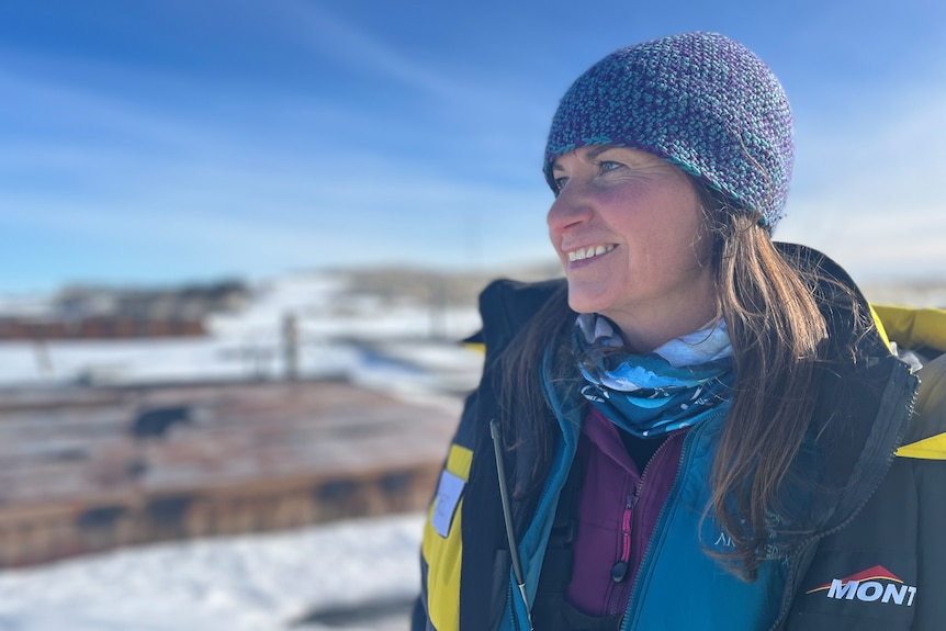 Dr Rebecca McWatters smiling in a snowy and desolate environment.
