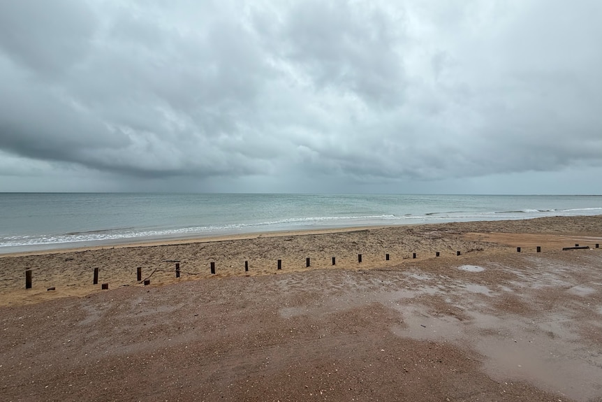 Photo of stormy weather over ocean from point of view of car