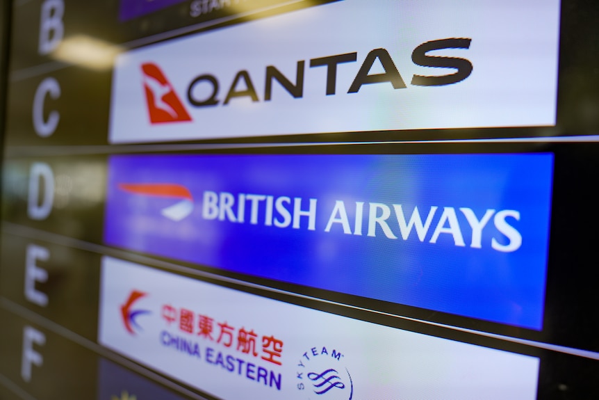A sign showing Qantas, British Airways and China Eastern.